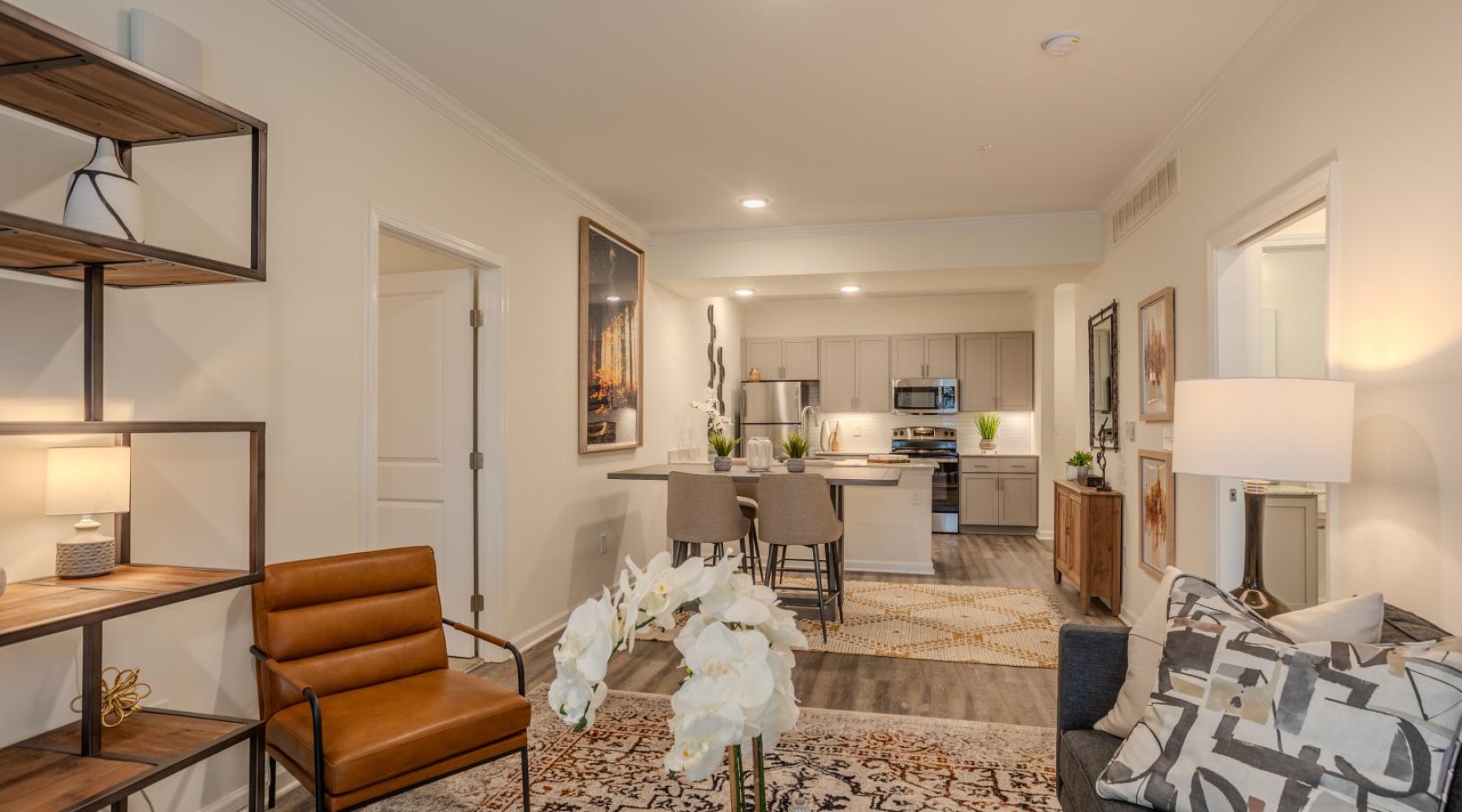 a living room with a dining table and chairs