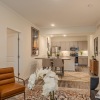 a living room with a dining table and chairs