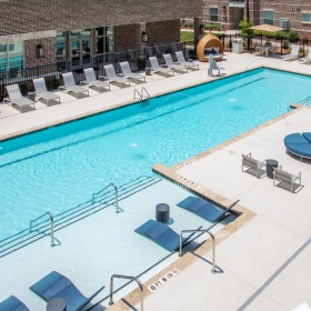 Sparkling swimming pool a swimming pool with chairs around it